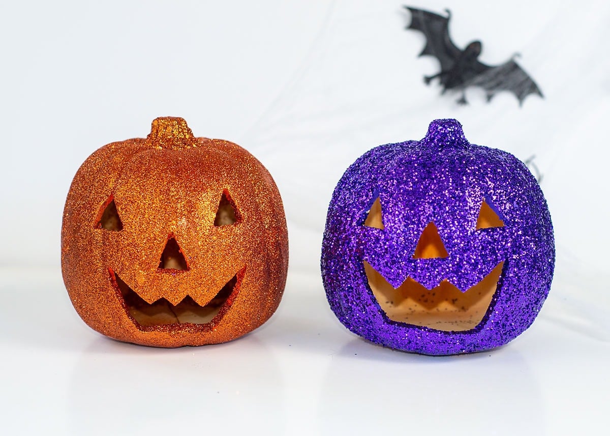 Colorful faux pumpkins decorated with sparkling glitter
