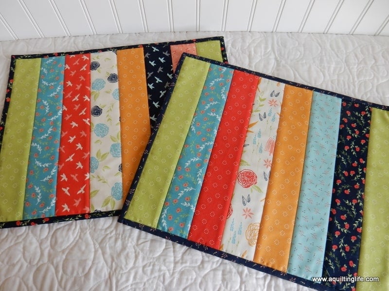 Quilt-as-you-go placemat sewn from strips of Christmas fabric