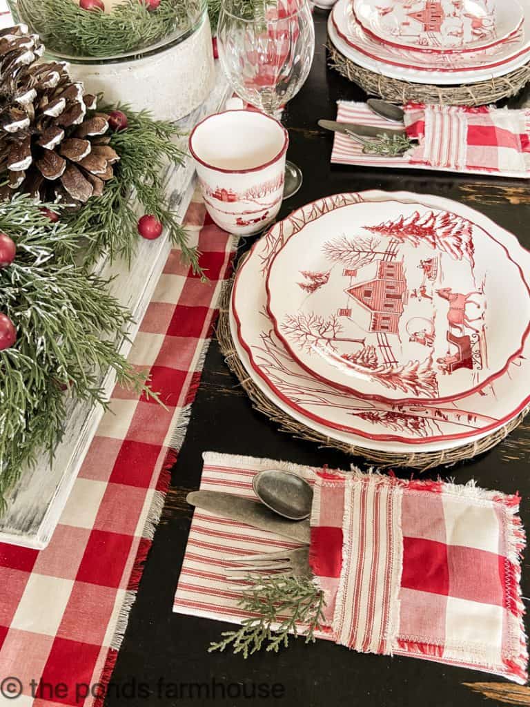 Ticking fabric napkin with a sewn-in pocket holding Christmas cutlery