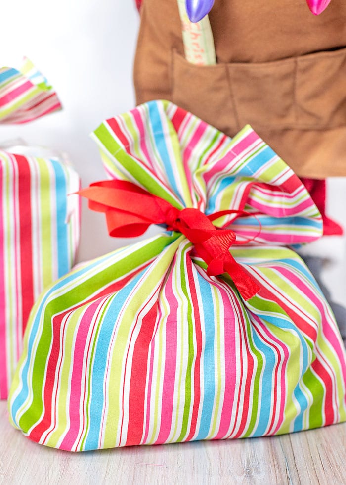 Striped Santa sack tied with a red ribbon bow