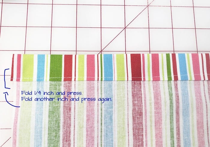 Top edge pressed under a quarter inch and then another inch for the hem