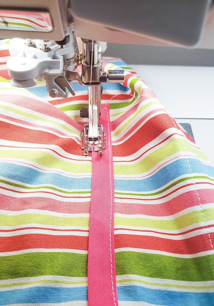 Sewing the second long edge of the casing to create a drawstring channel