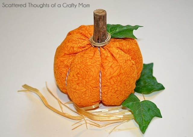 Finished orange fabric pumpkin with stem and leaves