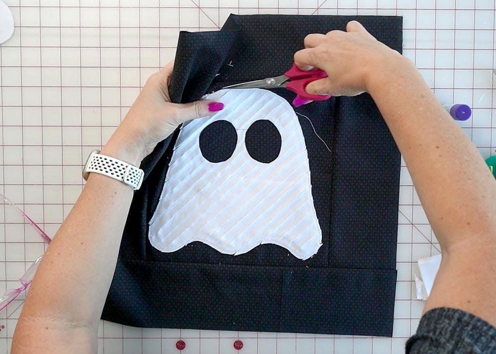 Sewing the textured ghost appliqué onto the pillow front
