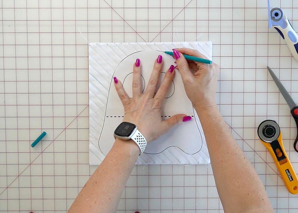 Tracing the ghost sewing pattern onto the back of the fabric